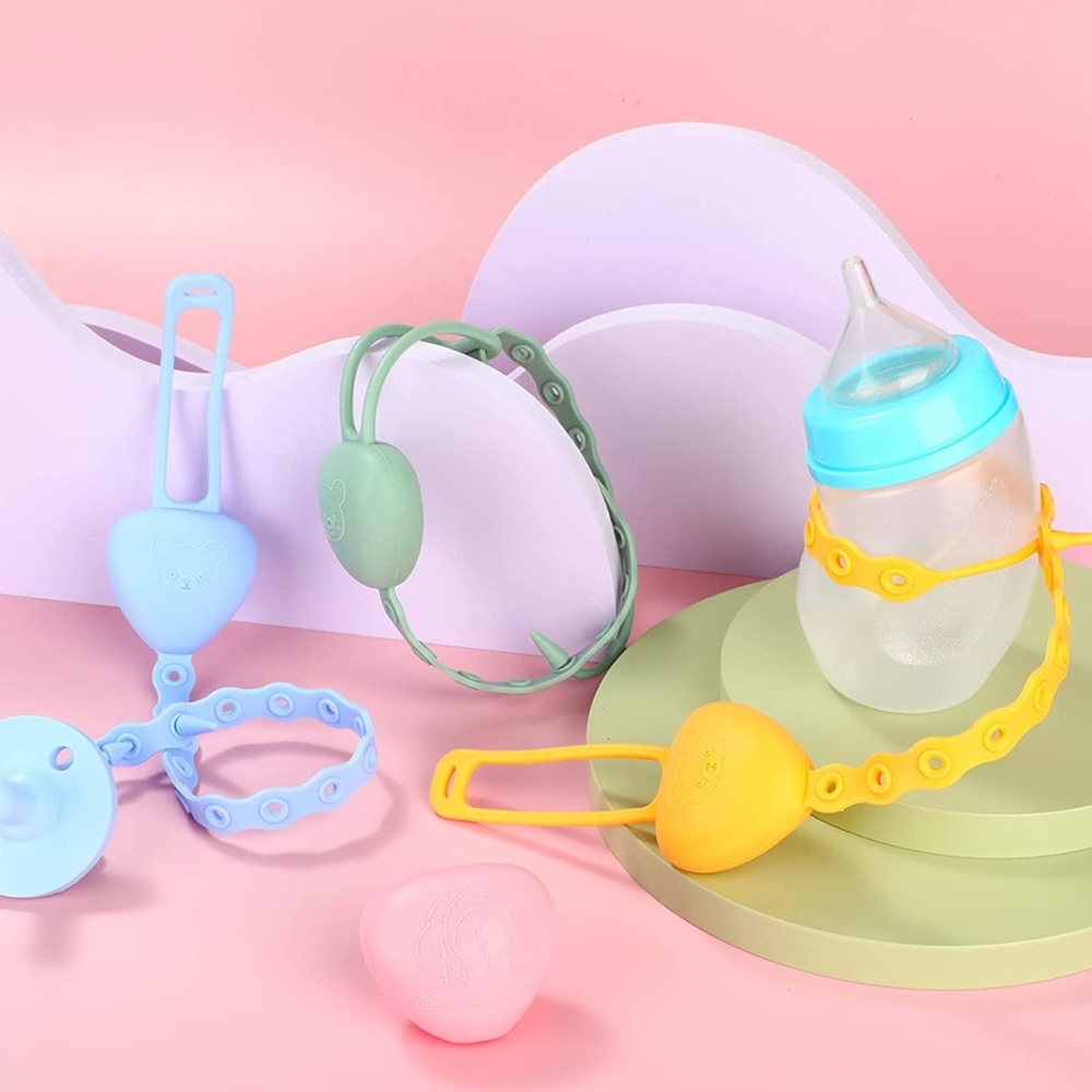 2 pink pacifier/toys holders